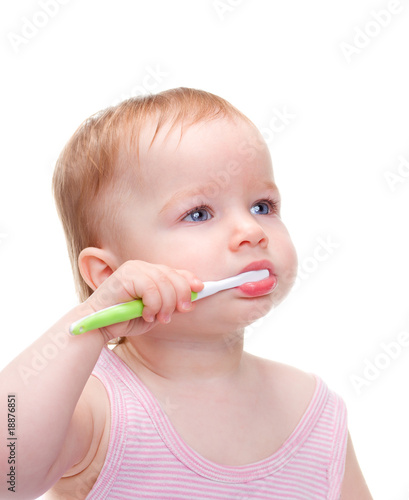 cute, little girl brushing her teeth