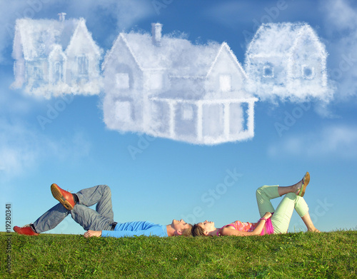 lying couple on grass and dream three cloud houses collage