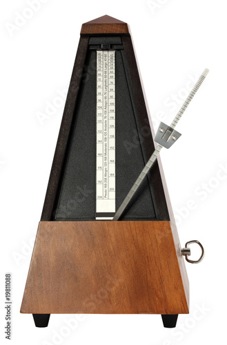 Mechanical Musicial Metronome on white background arm moving