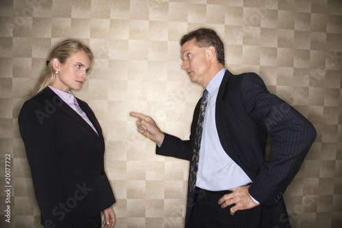 Businessman Reprimanding Businesswoman