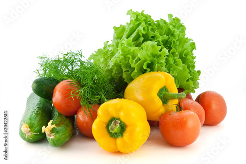 Fresh vegetables for salad on a white background