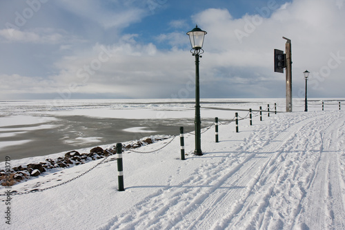 View from promenade at the frozen sea in wintertime