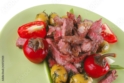 beef meat served on green