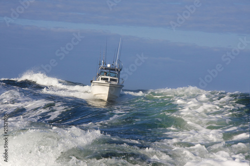 Pleasure craft style Sport Fishing Boat navigating rough seas