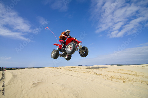 quadbike jumping dunes