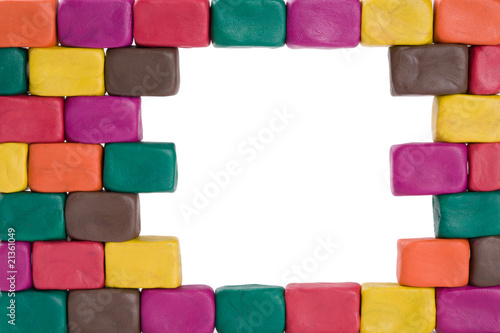 Frame of bricks made of colored plasticine.