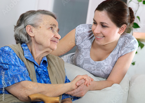 Senior woman with her home caregiver