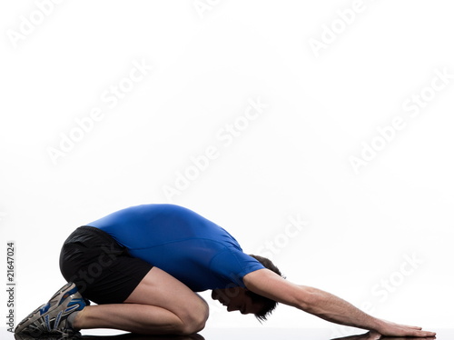 stretching posture by a man on studio white background