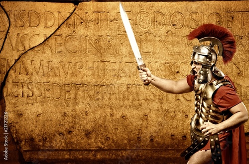 Roman legionary soldier in front of abstract wall