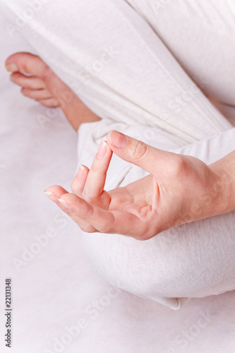 One hand of meditating woman in lotos pose