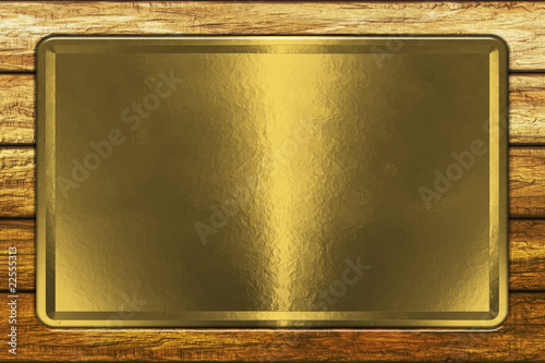Gold plate on grunge wall