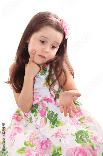 Cute little girl puzzled
