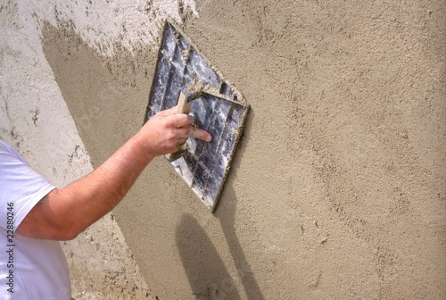 Plastering a wall outside