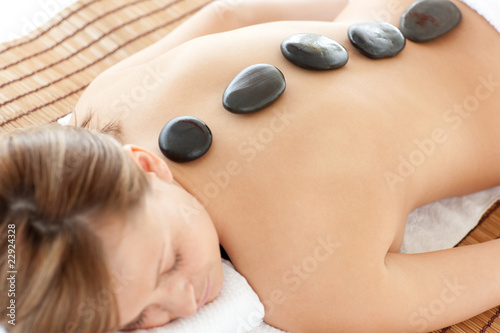 Bright woman lying on a massage table