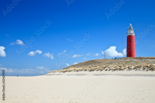 Lighthouse in the dunes at the beach