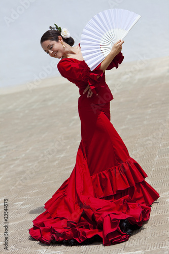 Traditional Woman Spanish Flamenco Dancer In Red Dress With Fan