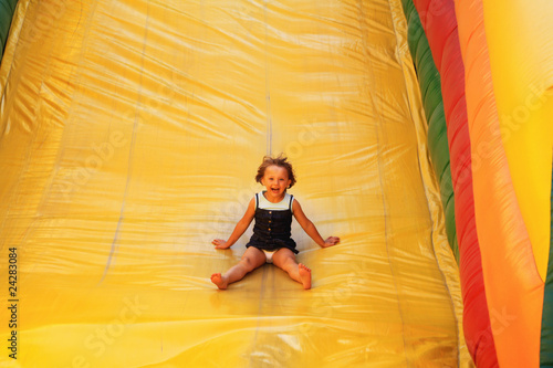 Young girl on the air slide