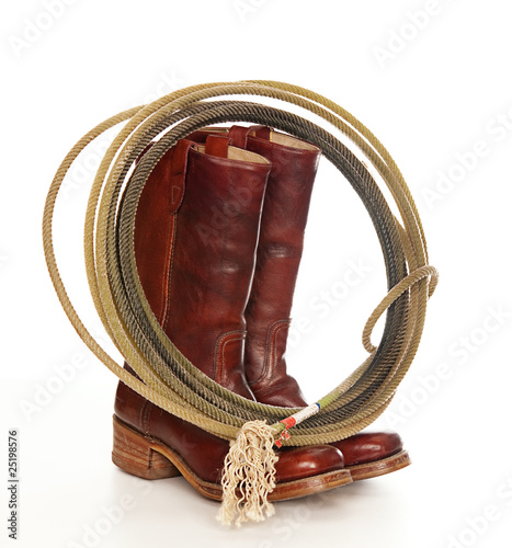 Western theme photo Cowboy boots and lasso