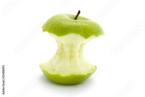 green apple core over white