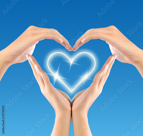 love sign by hand in blue background