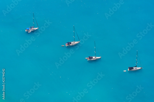 Aerial view of 4 sailing boats near Myrtos beach, Kefalonia