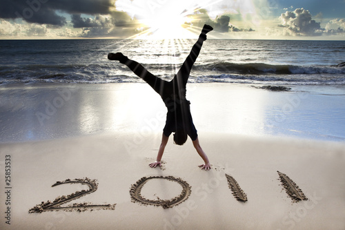 happy new year 2011 on the beach at sunrise