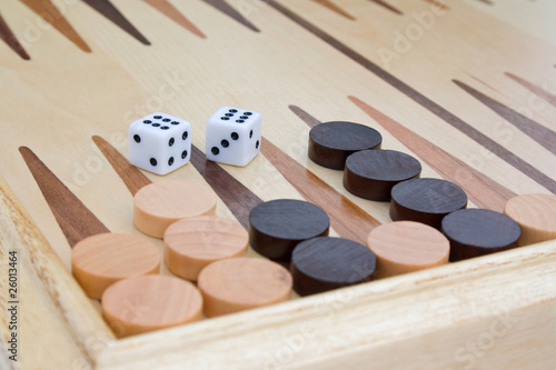 Wooden board for game in a backgammon and dice