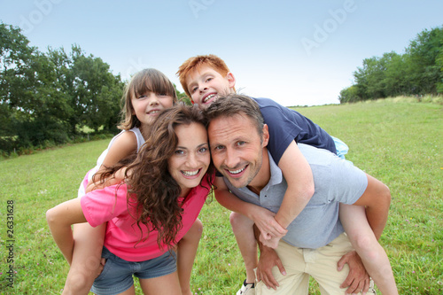 Parents doing piggyback to their children