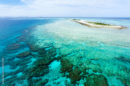 Aerial view of deserted tropical island on coral reef, Okinawa