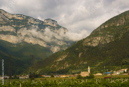 Сlouds lying over small village in Northern Italy