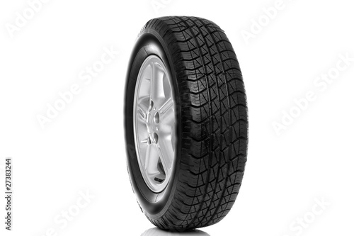 Photo of a car tyre (tire) on a five spoke alloy wheel isolated