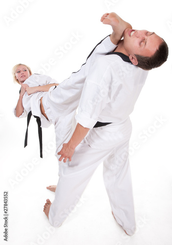 Two people in kimono fight on white