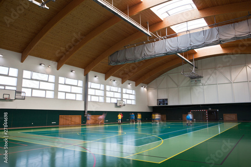 interior of a modern multifunctional gymnasium with young people