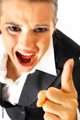 Furious modern business woman shaking her finger.