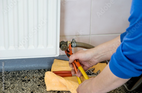 hands of a plumber repairman