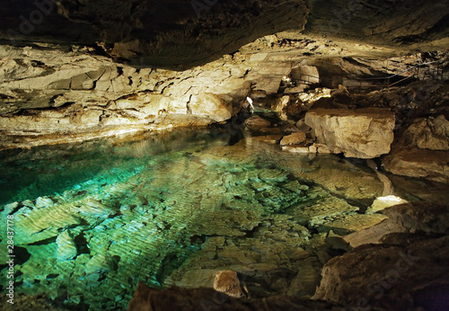 Grotto in Kungur Ice Cave with underground lake, Russia