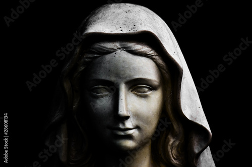 Holy Mary statue isolated on black
