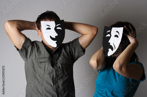 man and woman in theater black and white emotions masks, half bo