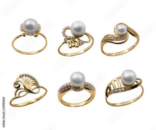 Set of elegant female jewelry golden rings with pearl