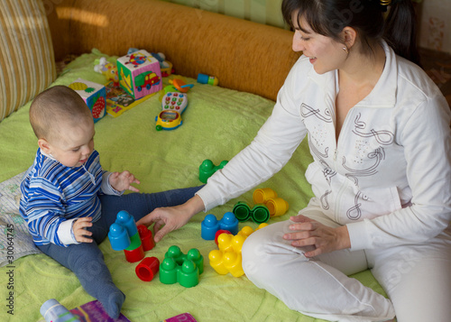 Mom playing with little son