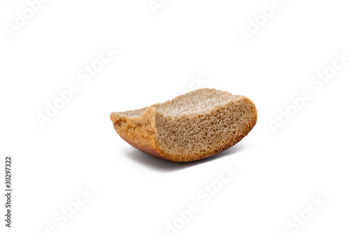 A piece of stale bread on a white background