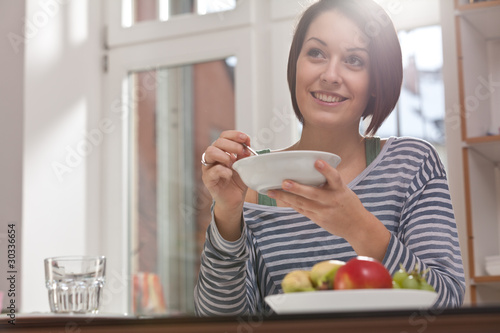 young woman having breakfast