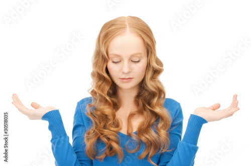 сlueless woman shrugging helpless with her shoulders