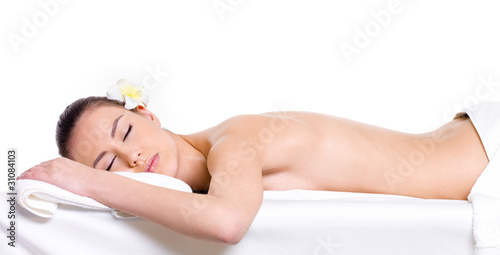 Young woman relaxing in spa salon