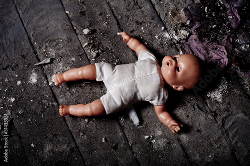 doll on dirty ground