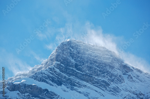 Snow spindrift on mountain peak 01