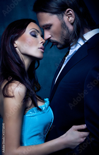 sexy, romantic portrait of the touching, kissing couple