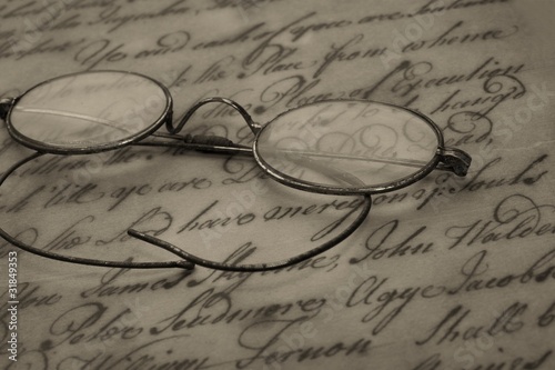 Old glasses on the vintage document