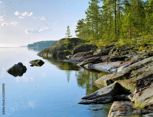 Stony shore of Ladoga lake at morning, Karelia, Russia