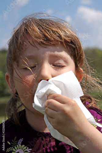 Allergies - the girl wipe your nose with a tissue
